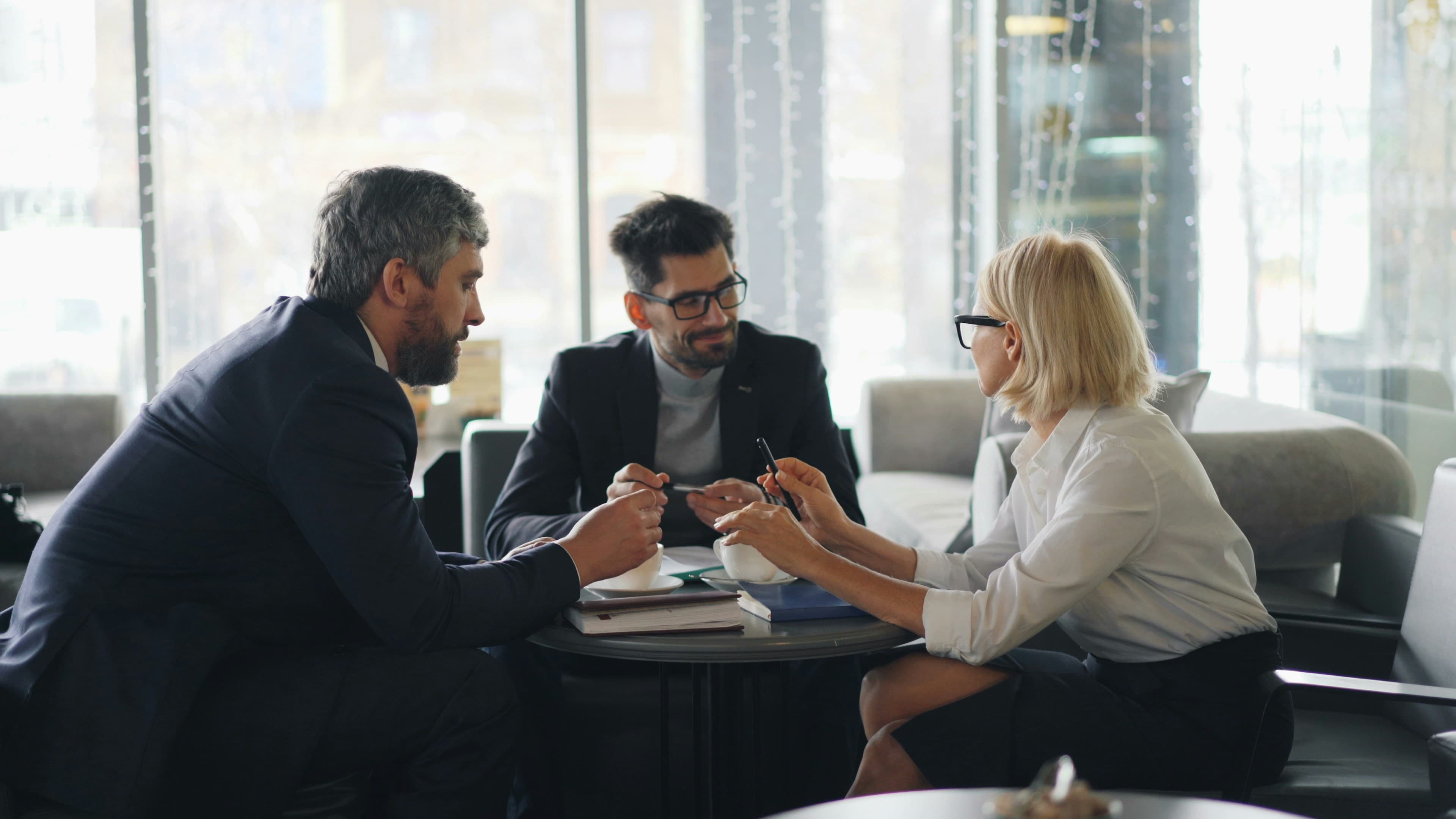 Business professionals in a meeting discussing company matters